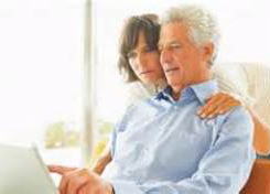 Couple looking at their computer screen